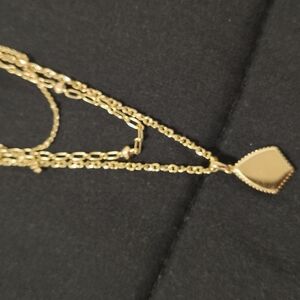 Kendra Scott Gold Pendant Necklace with Intricate Detailing